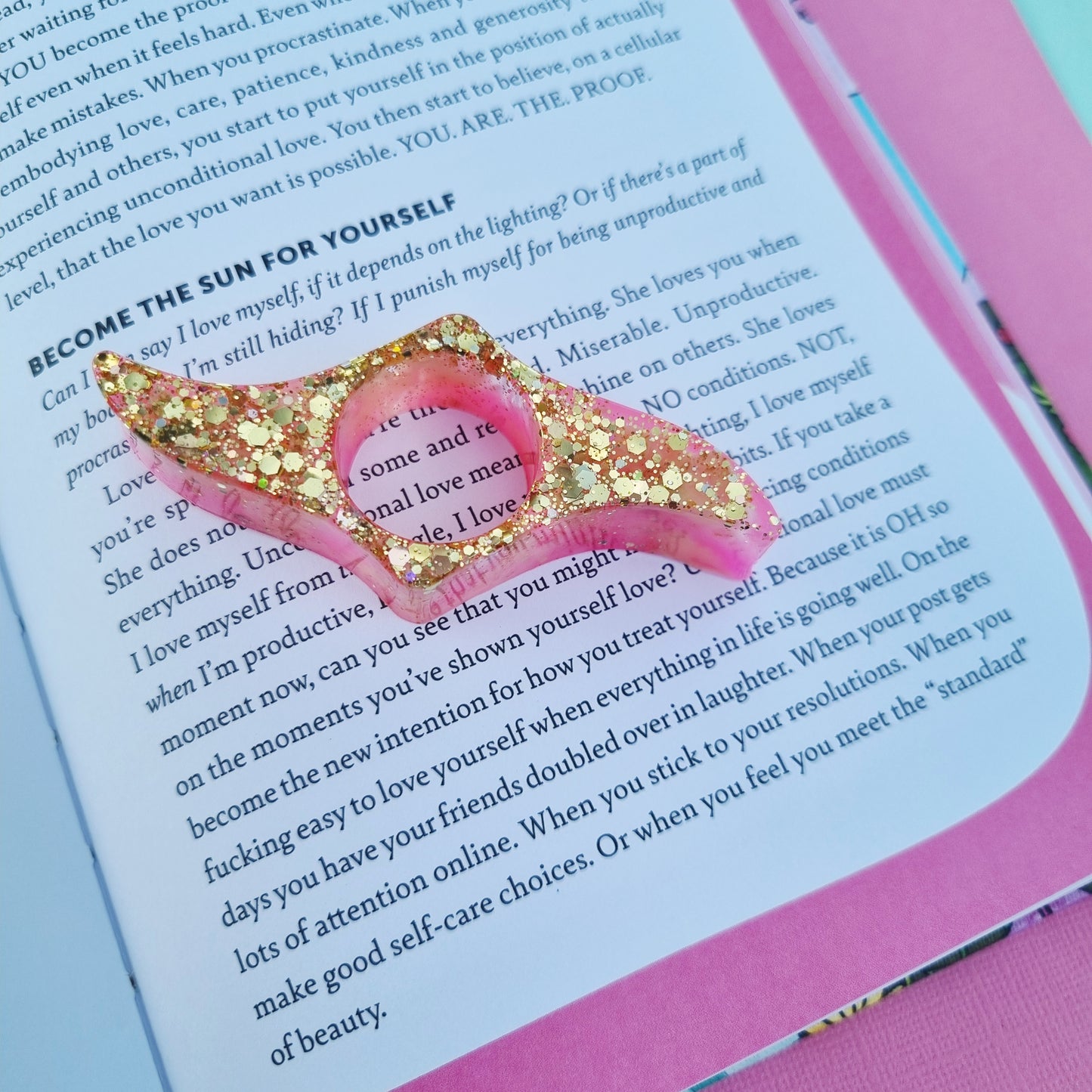 Resin thumb page holder