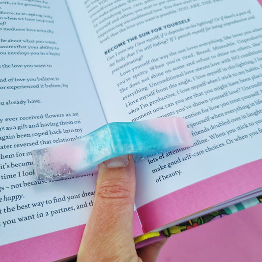 Resin thumb page holder